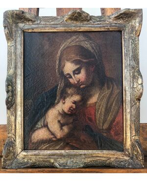 Oil painting on canvas depicting Madonna with Child Jesus. Emilian school.     