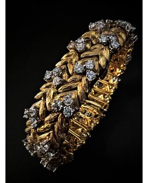 Bracciale  con  orologio  a scomparsa  firmato  " EBEL " 