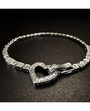 Bracciale  tennis  in  oro  bianco  con  chiusura a cuore 
