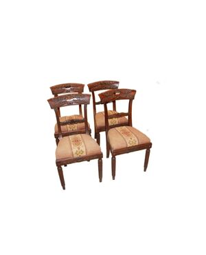 Set of 4 French Empire style chairs with richly carved backrests