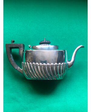 Silver teapot with art nouveau decorative motifs and ebony wood handle.Sheffield, England 1907.     