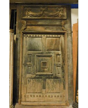 ptn205 door with carved portal, in walnut, meas. h 290 x 168 cm max     