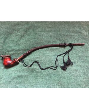 Sea foam and metal pipe with horn mouthpiece and flexible braid.     