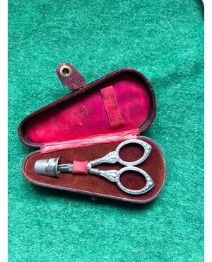 Silver scissor and thimble set with engraved geometric motifs with original box.     
