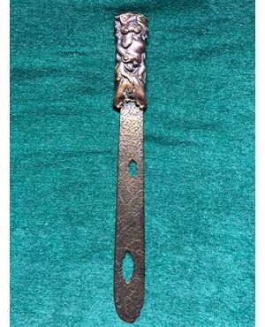 Brass letter opener with perforations decorated with stylized frogs and plant motifs. Japan.     