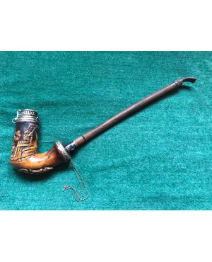 Sea foam and metal pipe with hunting scene.     