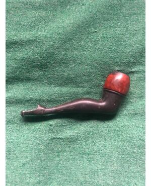 Wooden and bakelite pipe depicting a female leg.     