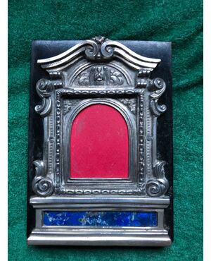 &#39;Pace-edicola&#39; in silver and lapis lazuli with rocaille and angel decoration, mounted on a picture frame on an ebonized wood base. Sicily.     