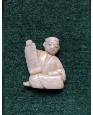 Ivory netsuke &#39;with sitting figure with papyrus. Japan.     