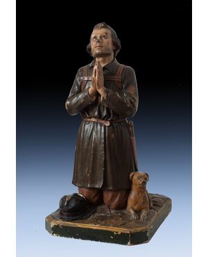 Carved wooden sculpture depicting San Rocco with the dog from the 18th century     