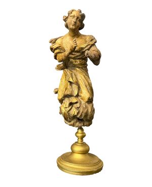 Scultura in legno intagliato e dorato 