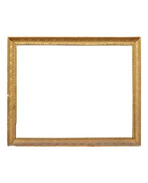 Cornice neoclassica in legno intagliato e dorato. Italia, inizi XIX secolo. 