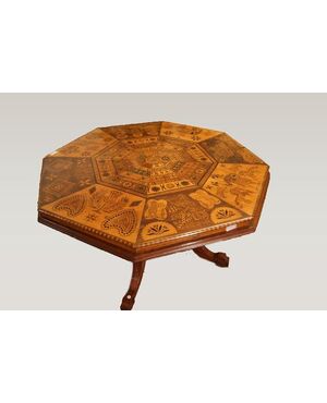 Antique English table with exotic taste from the 1800s, richly inlaid with animals and figures