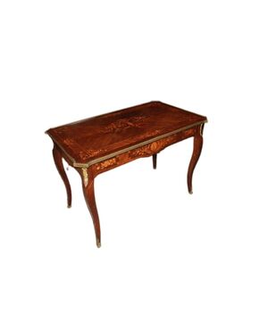 French Louis XV style desk from the 1800s with bronzes and rich marquetry motifs