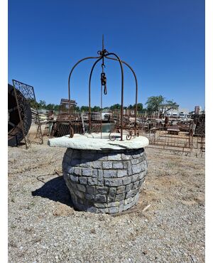 Stone well with iron arch
