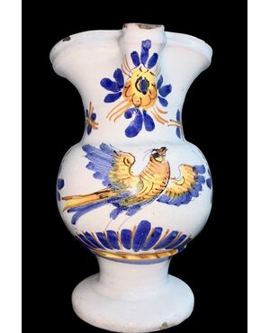Maiolica jug in compendiario style, decorated with a bird and vegetal motifs. Urbania manufacture.