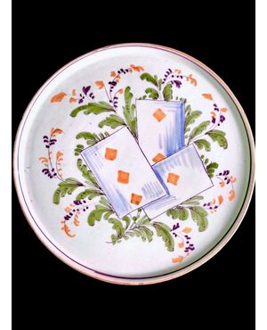 Majolica serving plate/cutting board with plant motifs and playing card decoration. Pavia.