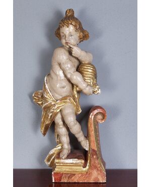 Scultura in legnio "Putto degustando miele"