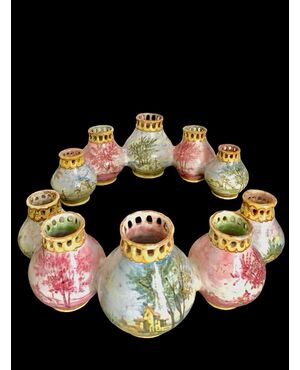 Centerpiece made up of two series of globular jars decorated with landscapes. Minghetti Bologna manufacture