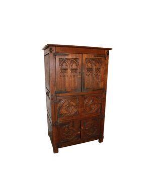 French cabinet from the early 1800s in richly carved oak wood