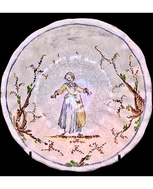 Majolica cup-basin decorated with a female figure and vegetal motifs. Levantino manufacture. Albisola.