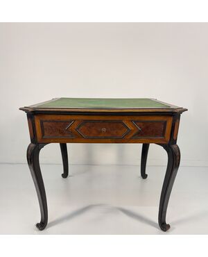 Walnut veneered game table, 19th century