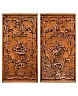 Pair of carved wooden wall panels. Italy, first half of the 20th century.