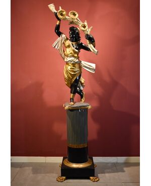 Antique sculpture of a female Moor with a flowered cornucopia