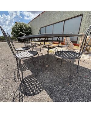 Large handmade wrought iron outdoor table with six chairs. Dimensions: 182 x 112 cm