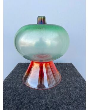 Globular vase in iridescent glass on a truncated cone base.Escribed logo BS.Murano     