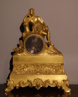 Orologio francese stile Impero del 1800 in bronzo dorato "Pensatore"