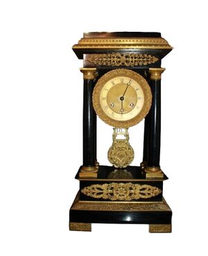 Orologio francese stile Impero del 1800 in legno ebanizzato con bronzi