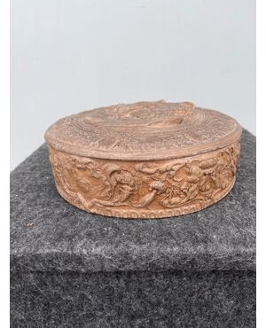 Terracotta box with mythological scene and trophies.Signa, Tuscany.     