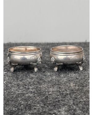 Pair of three-footed silver salt cellars with figures of harpies.     