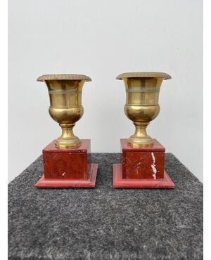 Pair of bronze vases with red marble base. Empire period.     