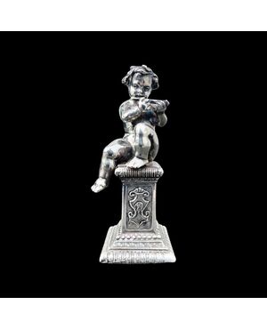 Small solid silver sculpture depicting a musical child. Italy.