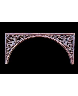 Carved wooden overdoor frieze with a scroll leaf motif.