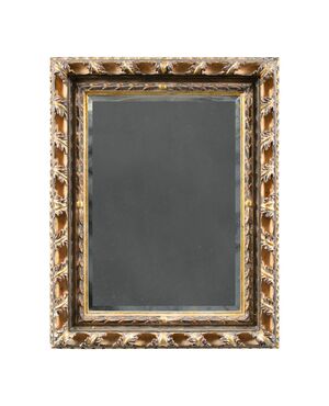 Liberty mirror in carved and gilded wood. Italy, 20th century.
