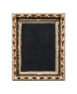 Liberty mirror in carved and gilded wood. Italy, 20th century.