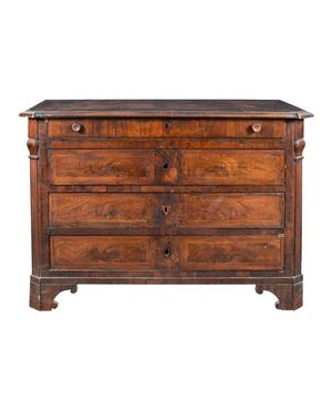 Walnut feather chest of drawers. Italy, early 19th century.