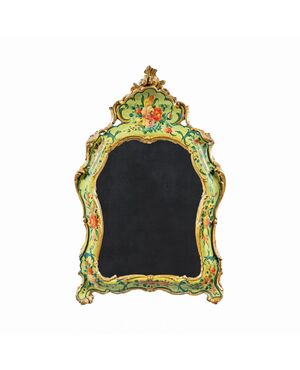 Carved, lacquered and painted wooden mirror. Venice, 18th century.