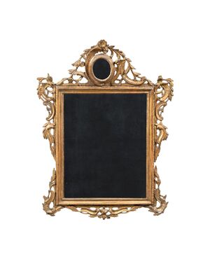 Carved and gilded wooden mirror. Venice, 18th century.