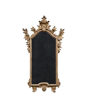 Carved and gilded wooden mirror. Northern Italy, 18th century.