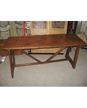 Trestle table in walnut