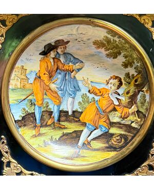 Majolica plate decorated with figures. Made in Castelli d’Abruzzo.