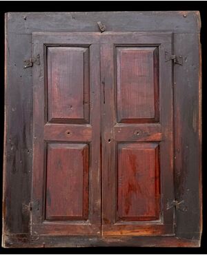 Two-door wall-mounted walnut cabinet.