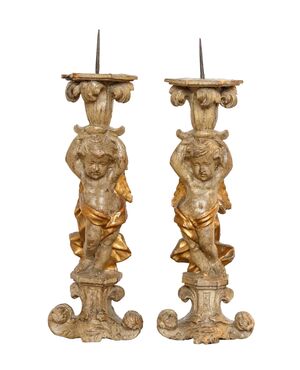 Pair of candle-holding putti