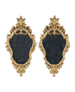Pair of carved and gilded wooden mirrors. Italy, 18th century.