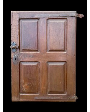 Carved walnut door panel with four panels.