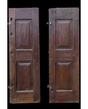 Pair of walnut doors with four engraved diamond panels.